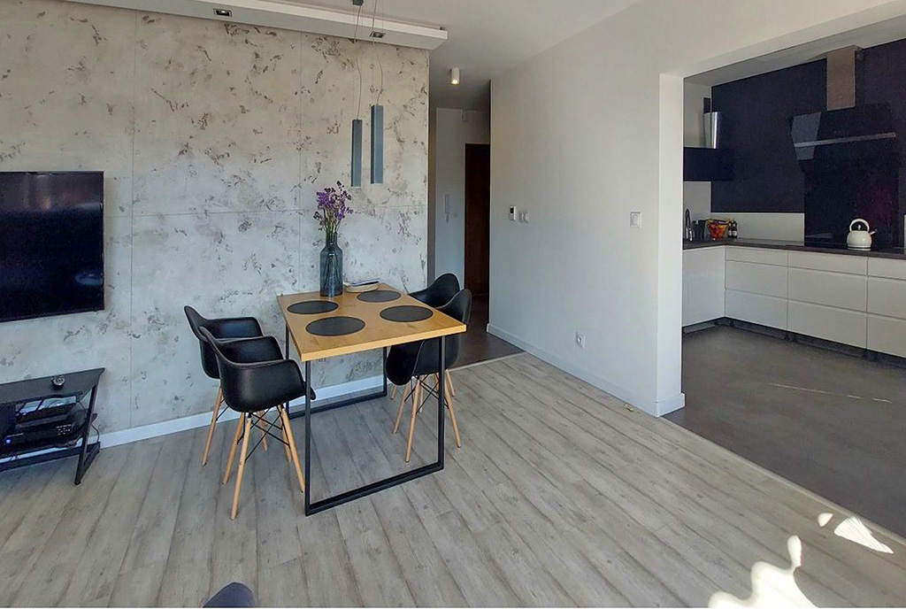 widok na jadalnię w luksusowym apartamencie na sprzedaż Piotrków Trybunalski