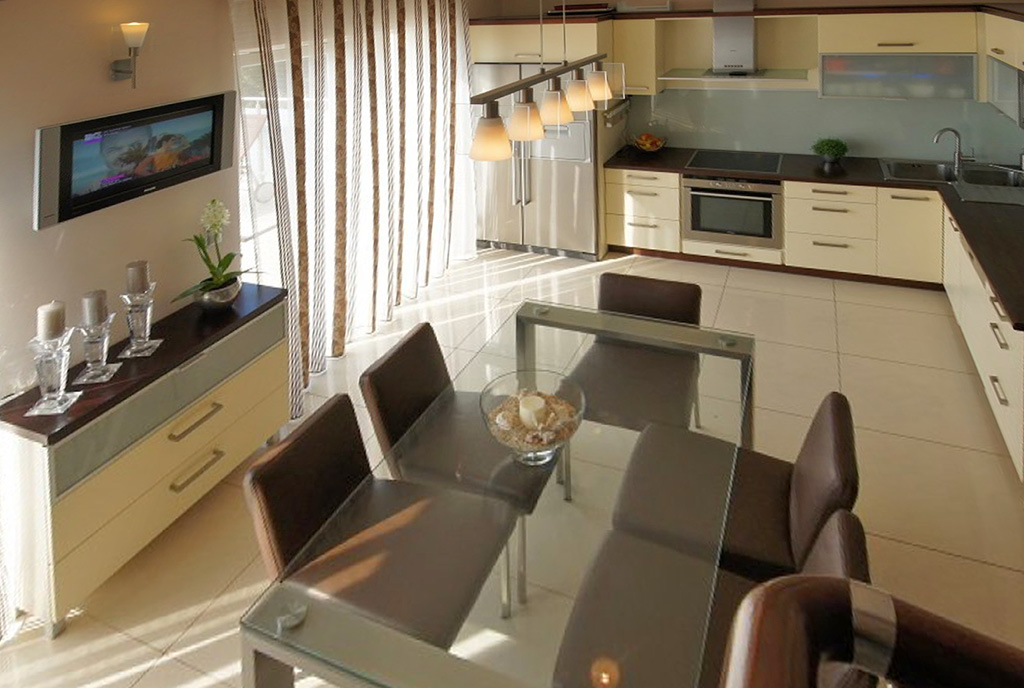 zdjęcie prezentuje aneks kuchenny i jadalnię w luksusowym apartamencie do wynajęcia Szczecin (okolice)