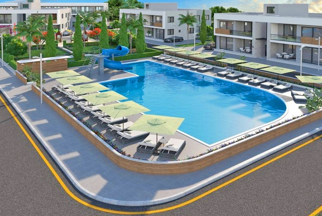 widok z lotu ptaka na osiedle z basenem, gdzie mieści się oferowany do sprzedaży ekskluzywny apartament Cypr (Gazimagusa)