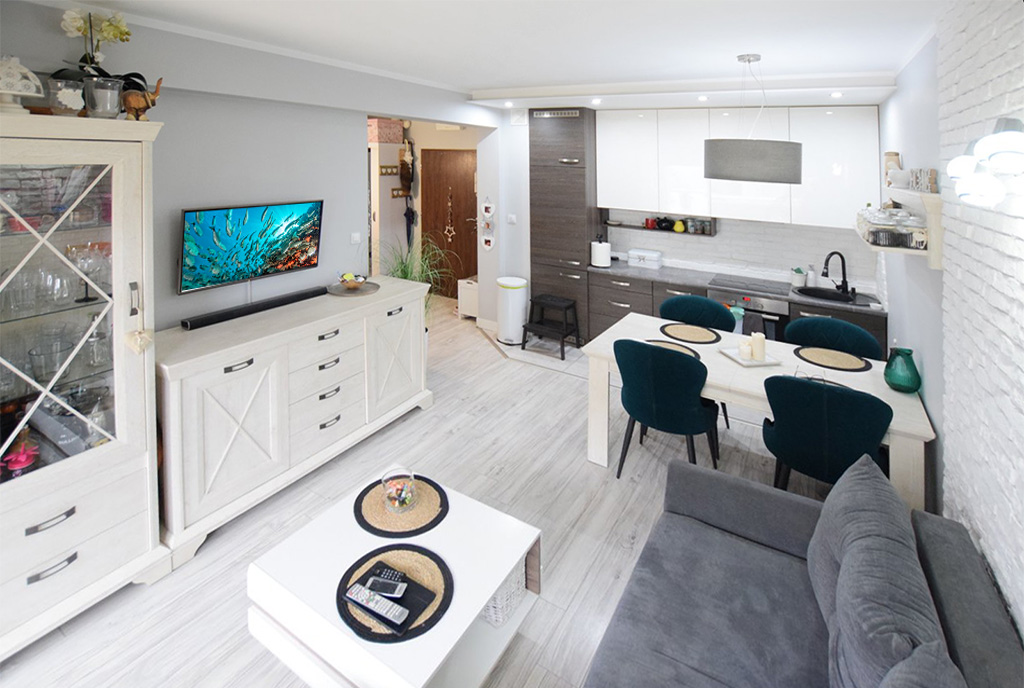 widok z salonu na aneks kuchenny w luksusowym apartamencie na sprzedaż Suwałki