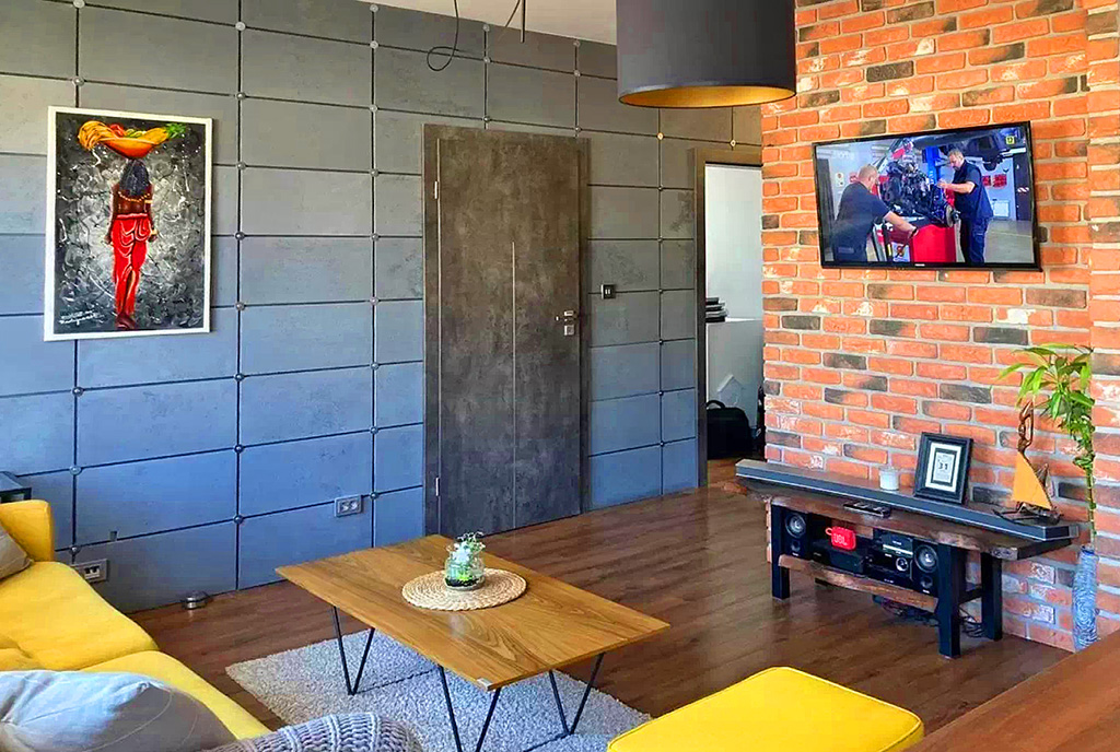 zaaranżowane w formie loftu wnętrze luksusowego apartamentu na sprzedaż Gdańsk