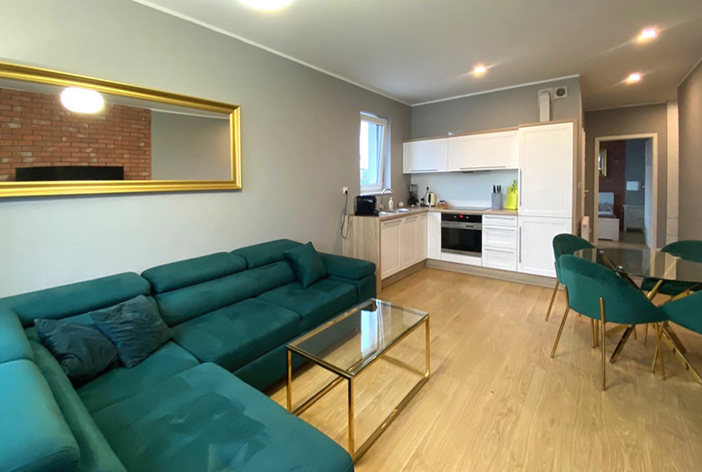 widok z salonu na aneks kuchenny w luksusowym apartamencie na sprzedaż Szczecin