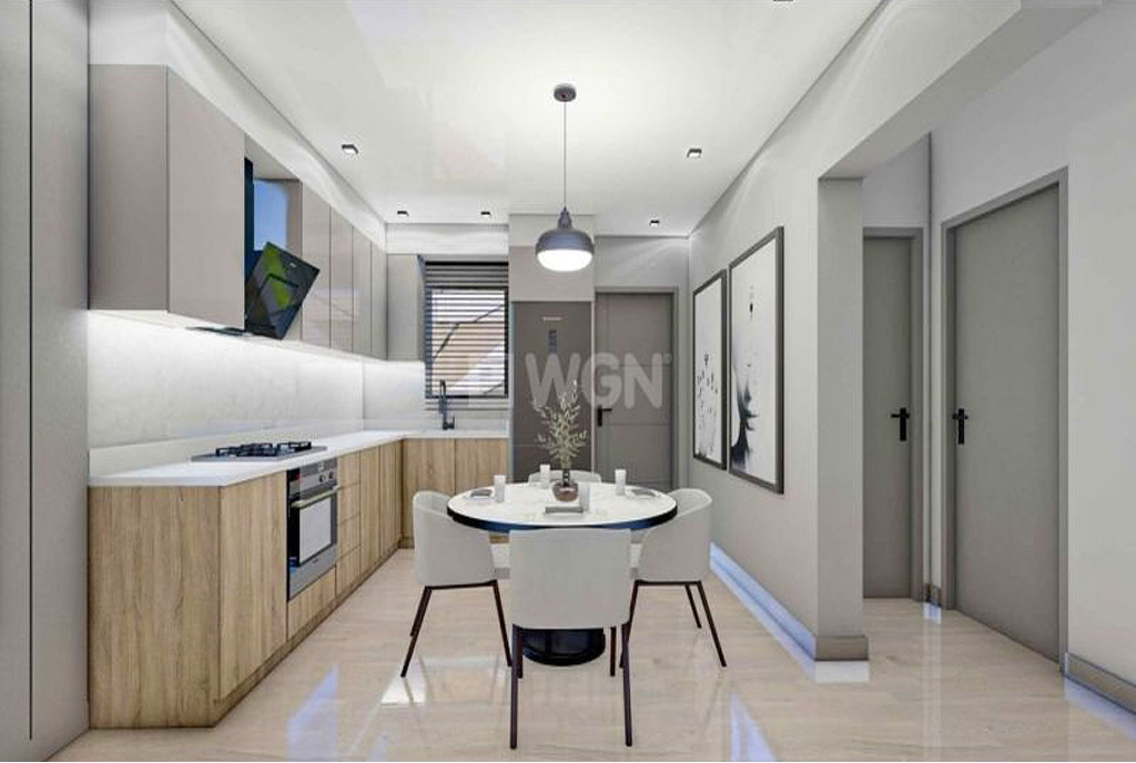na zdjęciu elegancka jadalnia + kuchnia w luksusowym apartamencie na sprzedaż Cypr (Isekle)