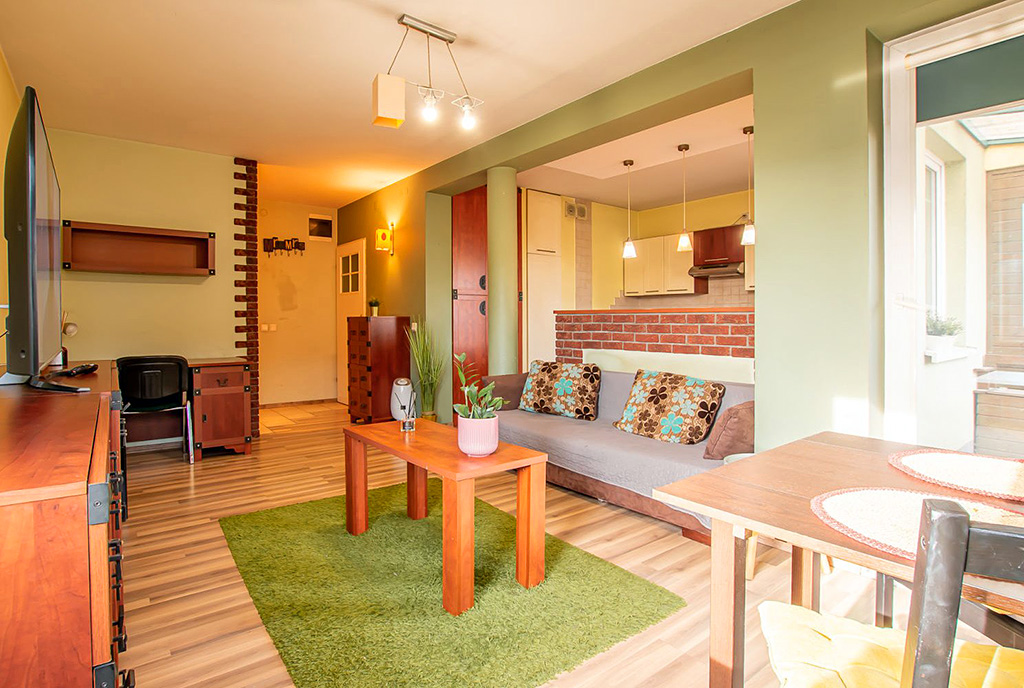 nowoczesna aranżacja salonu w ekskluzywnym apartamencie do sprzedaży Poznań