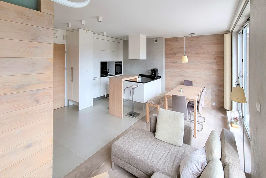 widok z salonu na aneks kuchenny w ekskluzywnym apartamencie do sprzedaży Ustroń