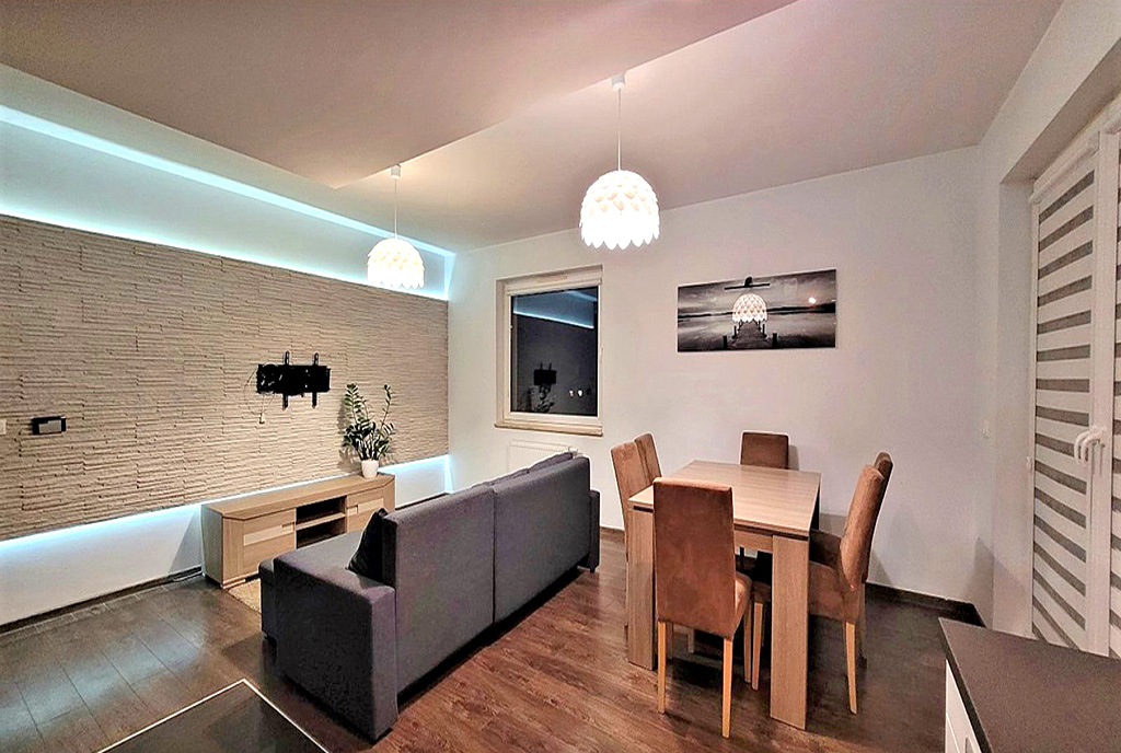 druga strona pokoju dziennego w luksusowym apartamencie na sprzedaż Wrocław (okolice)