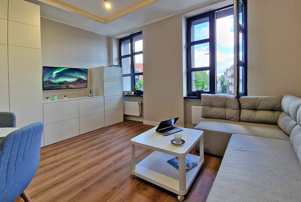 imponujący salon w luksusowym apartamencie do wynajmu Łódź
