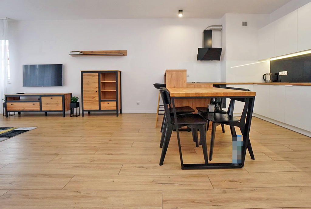 zbliżenie na jadalnię oraz salon w luksusowym apartamencie do wynajmu Piotrków Trybunalski