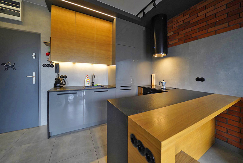imponujące oświetlenie kuchni w luksusowym apartamencie do wynajmu Łódź
