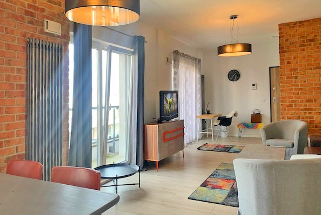 druga strona pokoju dziennego w luksusowym apartamencie do wynajmu Wrocław