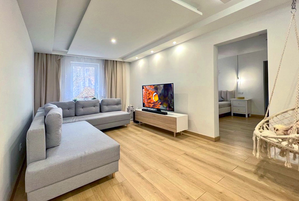 nowoczesny pokój dzienny w ekskluzywnym apartamencie do sprzedaży Legnica (okolice)