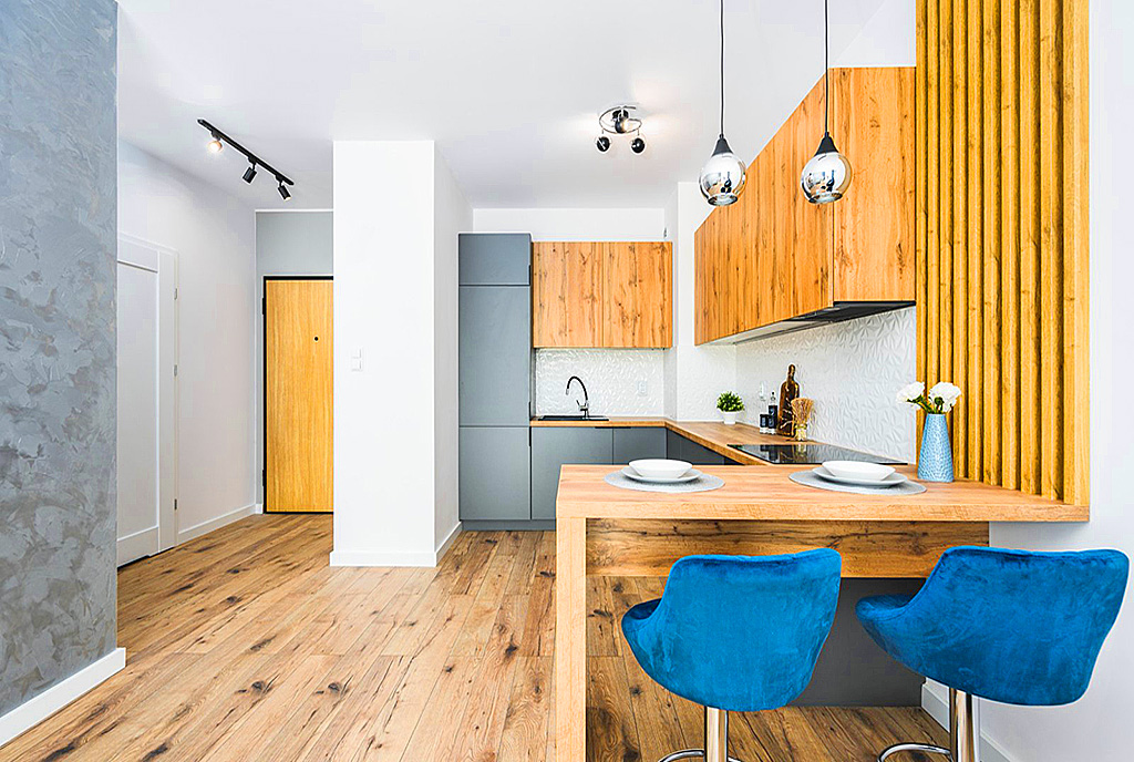 widok na jadalnię i aneks kuchenny w luksusowym apartamencie na sprzedaż Gdańsk