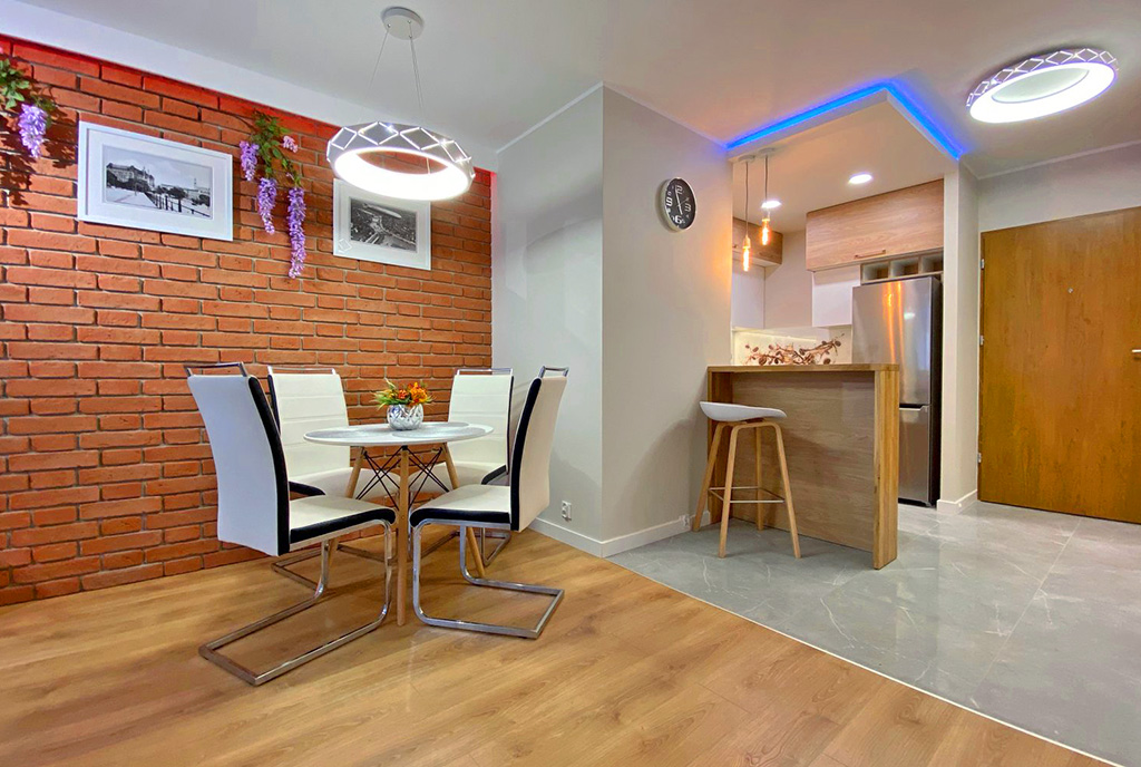 jadalnia oraz aneks kuchenny w luksusowym apartamencie do wynajmu Szczecin