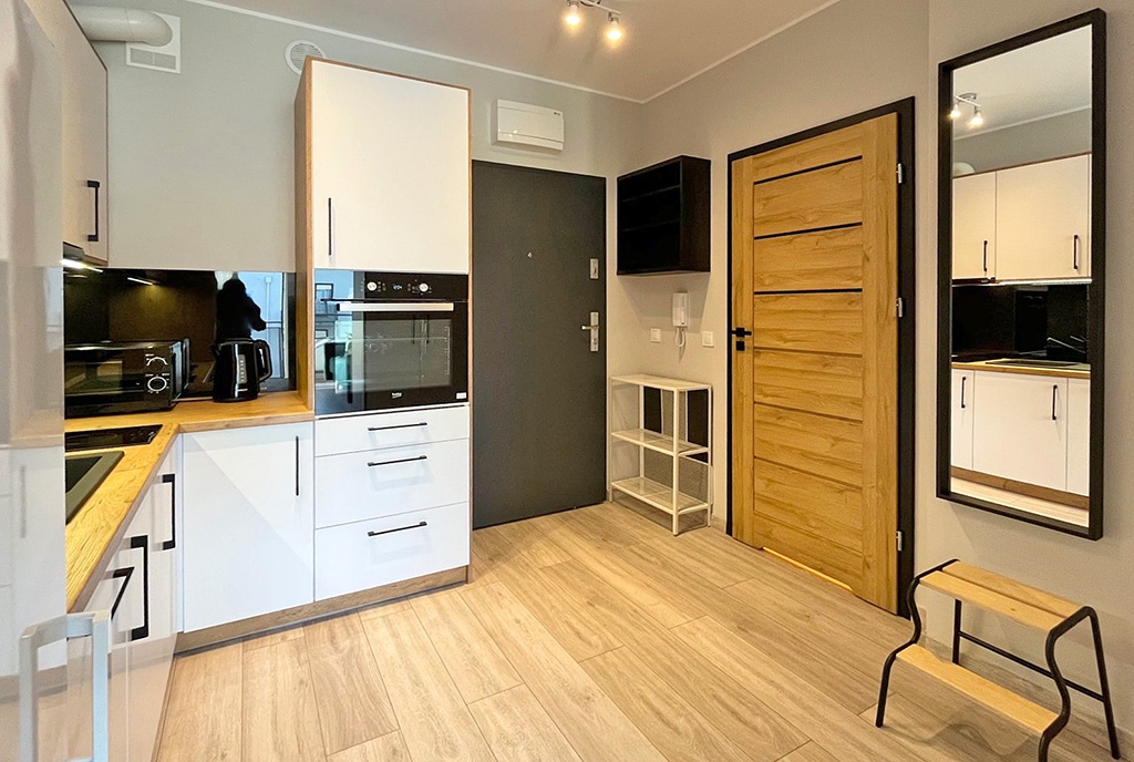 zaprojektowana zgodnie z najnowszymi trendami kuchnia w ekskluzywnym apartamencie na wynajem Szczecin