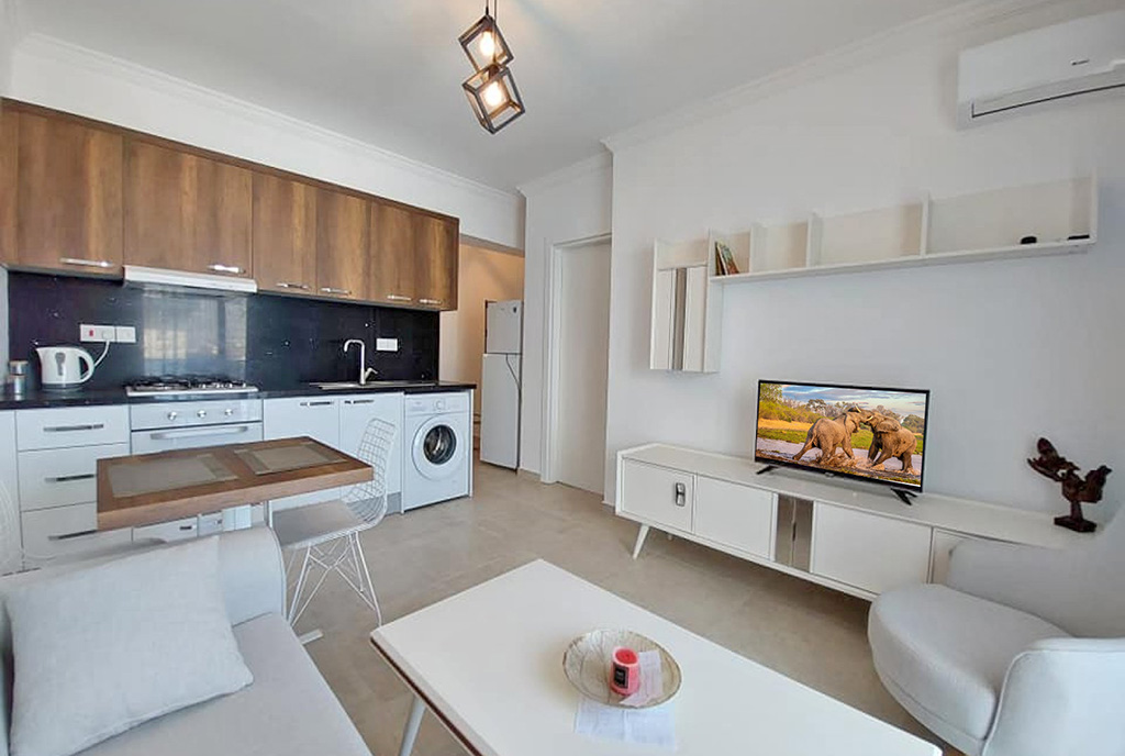 utrzymany w jasnych kolorach salon w ekskluzywnym apartamencie na sprzedaż Cypr (Iskele)