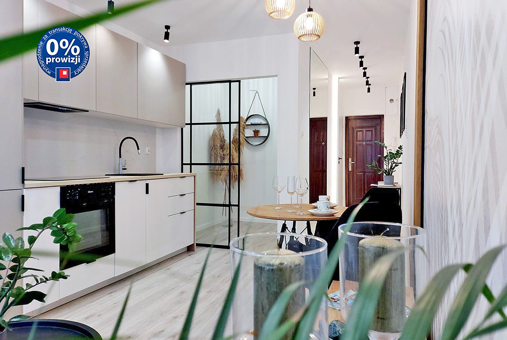 widok z salonu na aneks kuchenny w ekskluzywnym apartamencie do sprzedaży Gdańsk