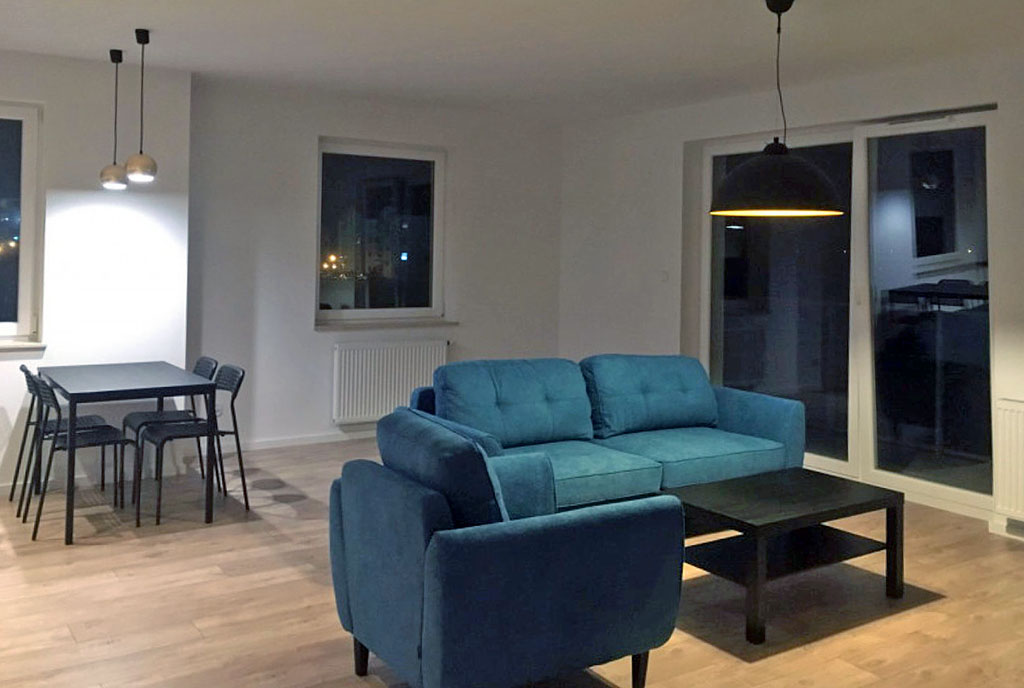 przeciwległa ściana pokoju dziennego w luksusowym apartamencie na sprzedaż Gdańsk