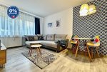 przeciwległa ściana salonu w luksusowym apartamencie na sprzedaż Słupsk
