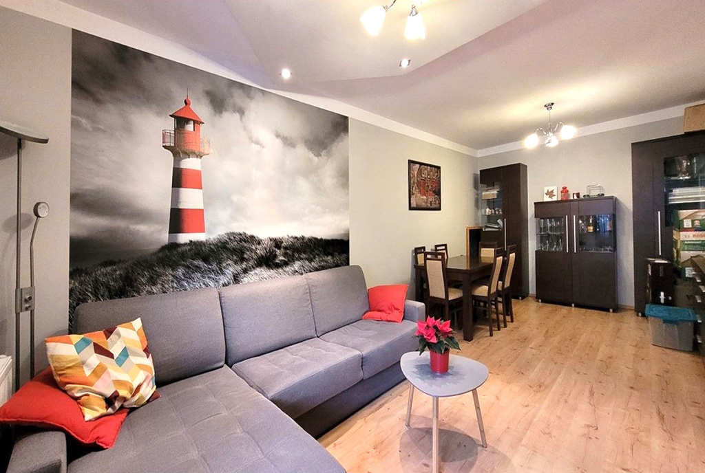 lewa część pokoju dziennego w luksusowym apartamencie na sprzedaż Wrocław