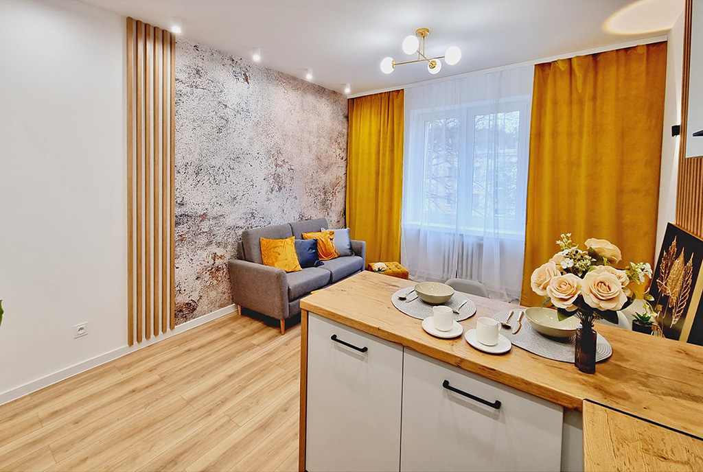 widok od kuchni na salon w luksusowym apartamencie na sprzedaż Mielec
