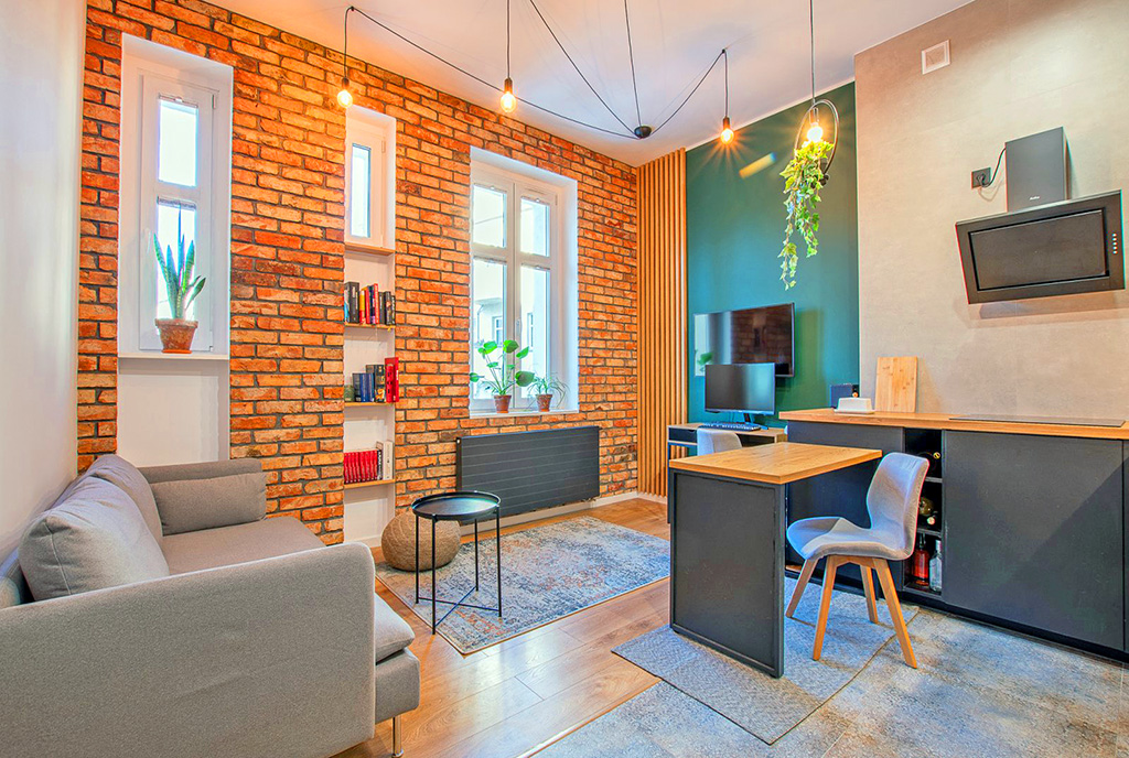 zaprojektowane w stylu loftu wnętrze ekskluzywnego apartamentu do sprzedaży Poznań