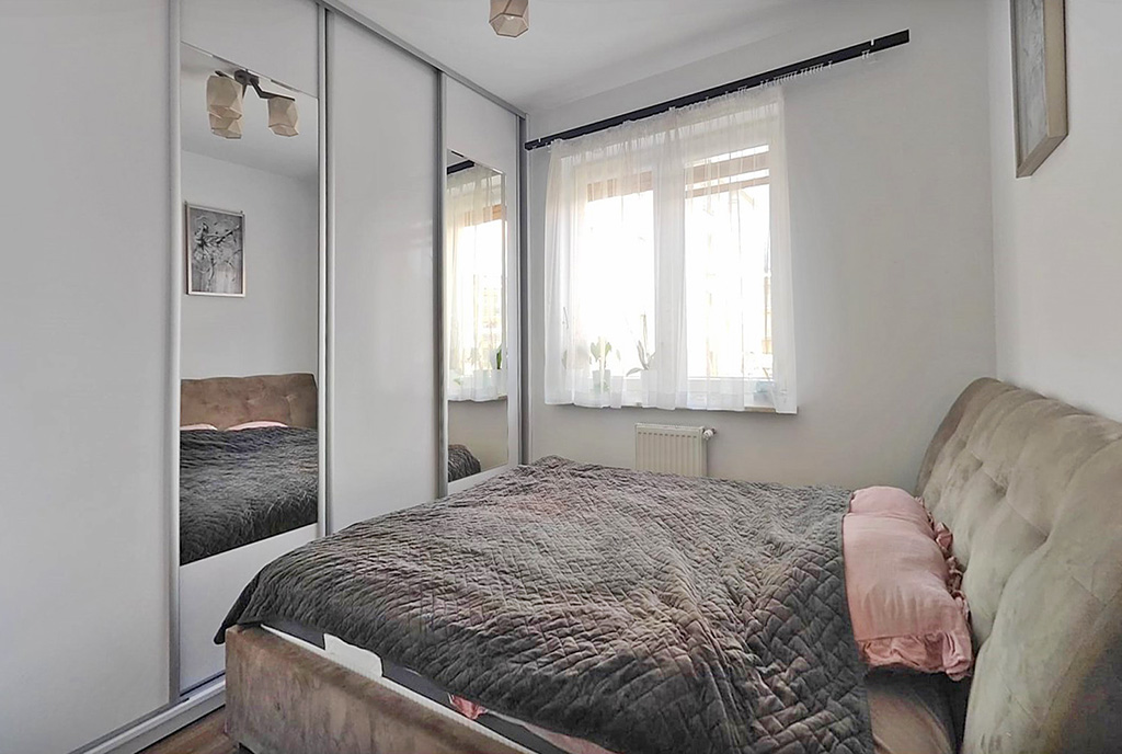 zaciszna sypialnia w ekskluzywnym apartamencie na sprzedaż Ełk
