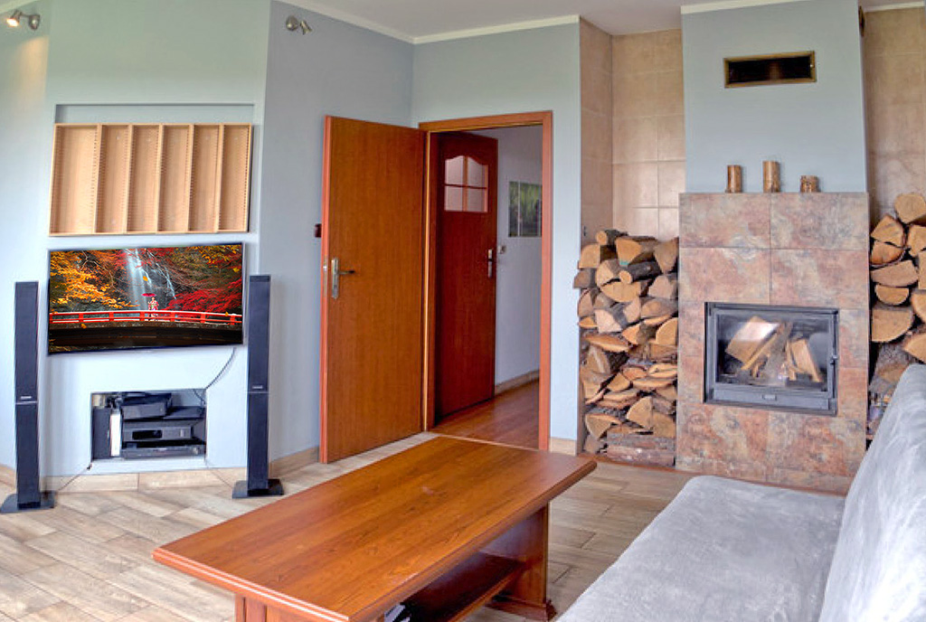 kominek w salonie ekskluzywnego apartamentu do sprzedaży Piotrków Trybunalski