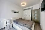 elegancka sypialnia w ekskluzywnym apartamencie na sprzedaż Słupsk