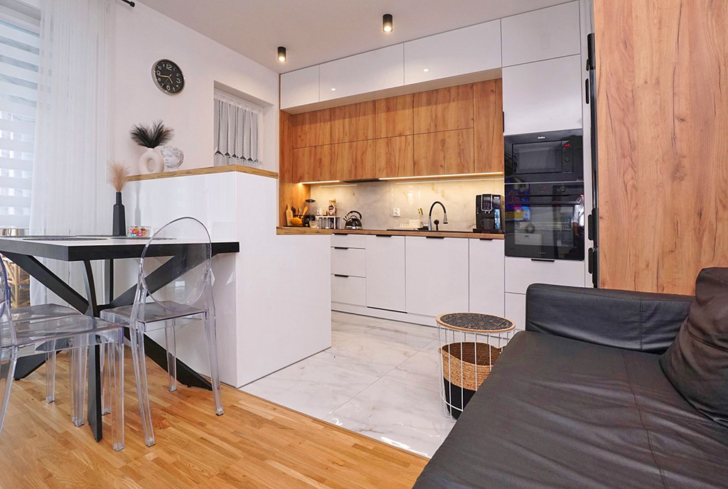 widok z salonu na aneks kuchenny w luksusowym apartamencie do wynajmu Apartament na wynajem Piotrków Trybunalski