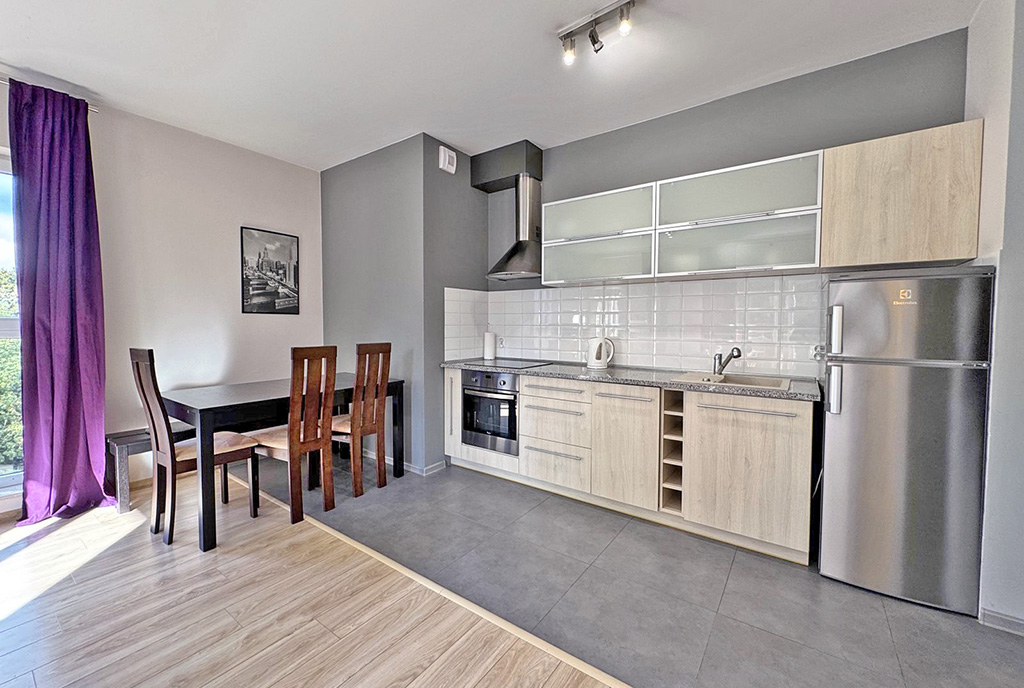 zaprojektowana zgodnie z najnowszymi trendami kuchnia w luksusowym apartamencie do wynajmu Szczecin