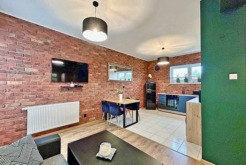 widok na aneks kuchenny w luksusowym apartamencie na sprzedaż nad morzem