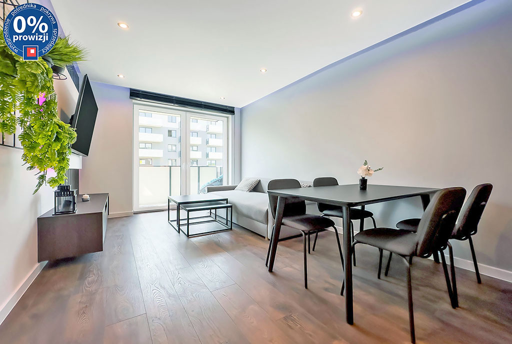 po lewej jadalnia, na wprost salon w luksusowym apartamencie na sprzedaż Katowice (okolice)