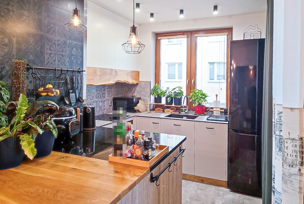 kuchnia z wyspą w ekskluzywnym apartamencie na sprzedaż Ełk