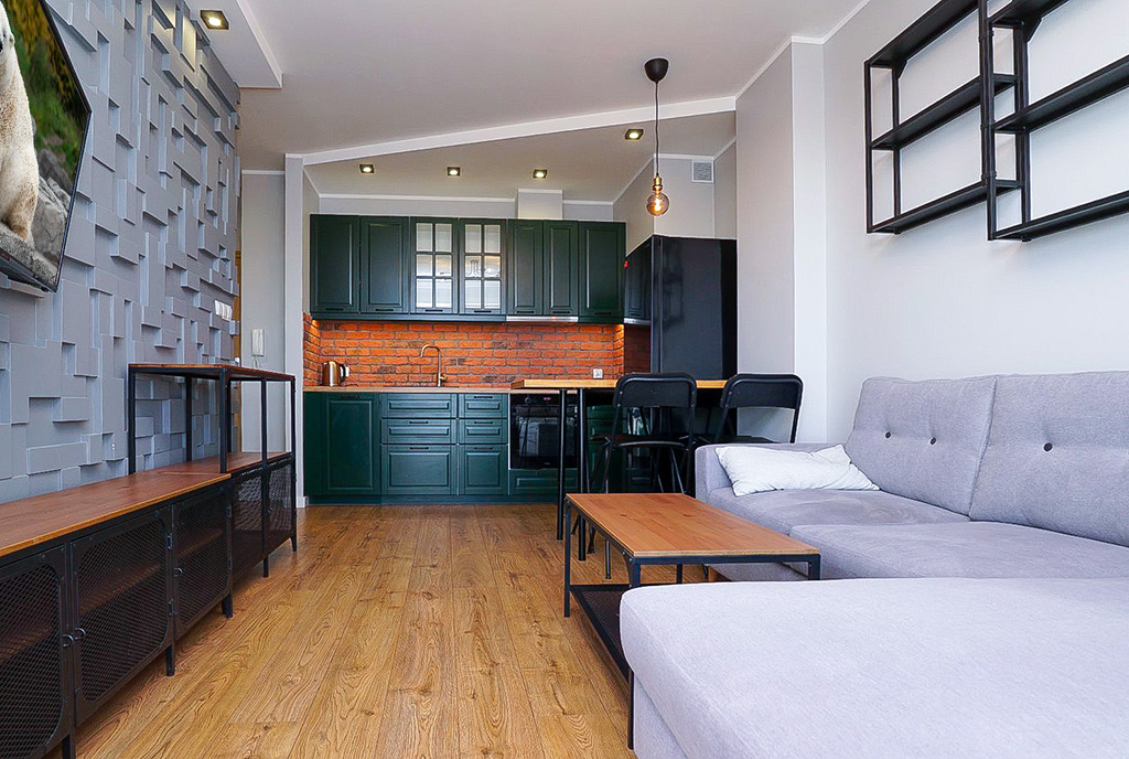 salon i kuchnia w ekskluzywnym apartamencie do sprzedaży Piotrków Trybunalski