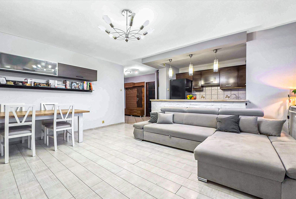 widok z salonu na aneks kuchenny w ekskluzywnym apartamencie do sprzedaży okolice