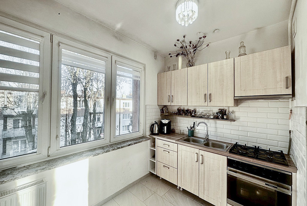 zbliżenie na kuchnię w ekskluzywnym apartamencie na sprzedaż Słupsk