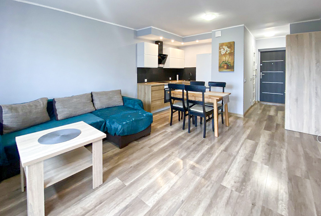 widok z salonu na aneks kuchenny w ekskluzywnym apartamencie do sprzedaży Szczecin