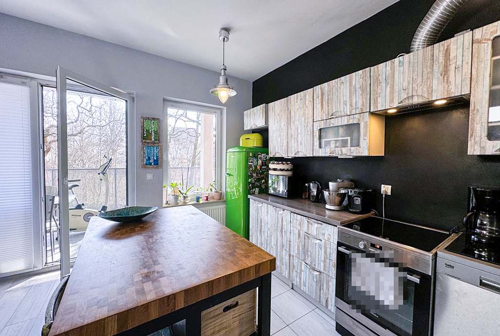 kuchnia z wyspą w luksusowym apartamencie na sprzedaż Wrocław