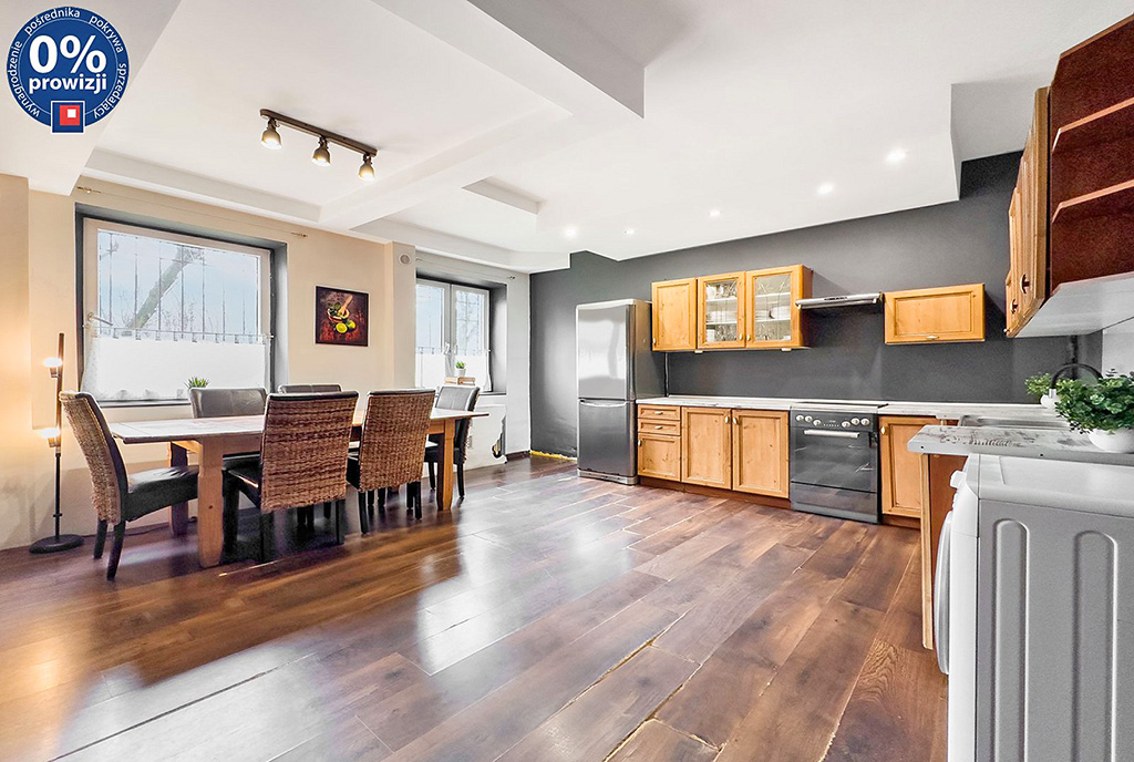 po lewej jadalnia, po prawej kuchnia w ekskluzywnym apartamencie do sprzedaży Katowice okolice