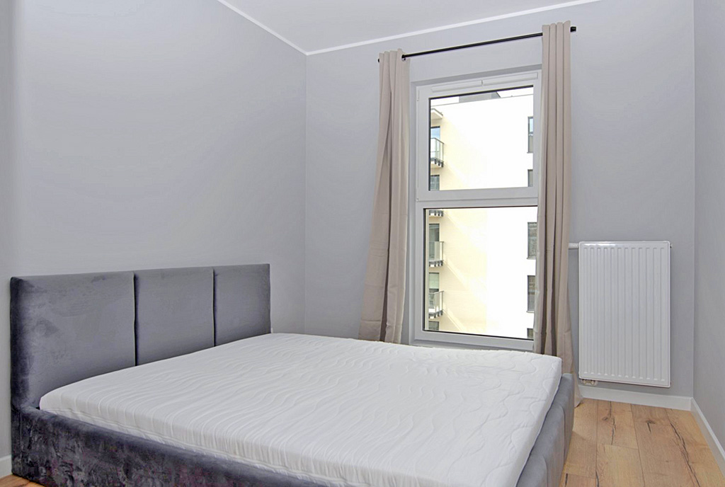 fragment sypialni w ekskluzywnym apartamencie na wynajem Poznań