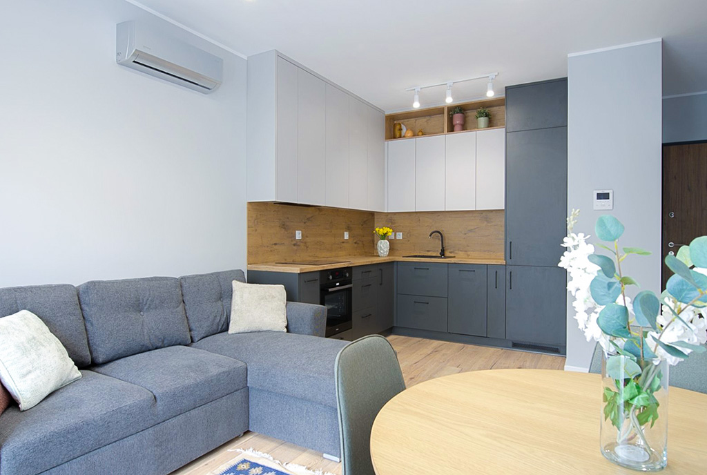 jadalnia oraz kuchnia w luksusowym apartamencie do wynajmu Poznań