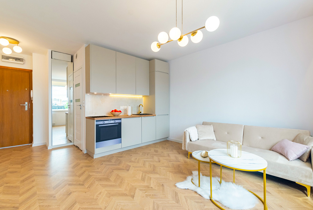 widok z salonu na aneks kuchenny w ekskluzywnym apartamencie do sprzedaży Gdańsk