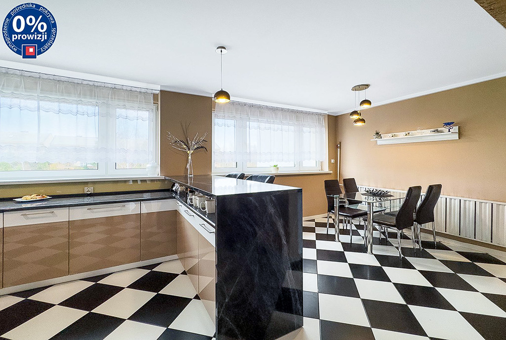 zaprojektowane w czerni i bieli kuchnia w luksusowym apartamencie na sprzedaż Katowice okolice