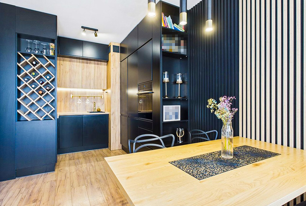 zaprojektowana w czerni kuchnia w ekskluzywnym apartamencie na sprzedaż Legnica okolice