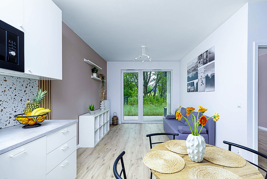 zbliżenie na jadalnię i kuchnię w luksusowym apartamencie na sprzedaż Poznań