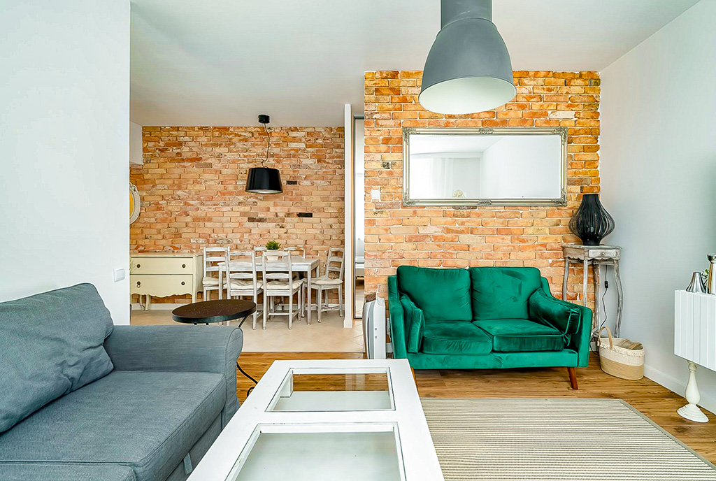 ciekawa aranżacja pokoju dziennego w luksusowym apartamencie na sprzedaż Poznań