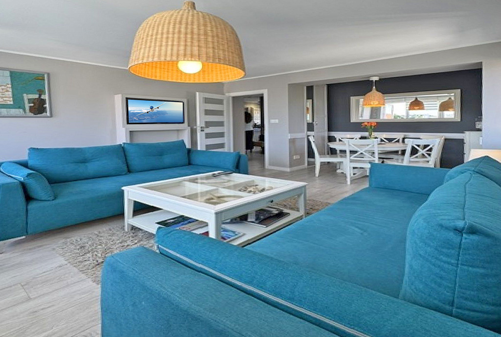 zaprojektowany w skandynawskim stylu salon w ekskluzywnym apartamencie do sprzedaży Sopot