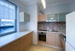 na zdjęciu kuchnia w luksusowym apartamencie do wynajmu Szczecin