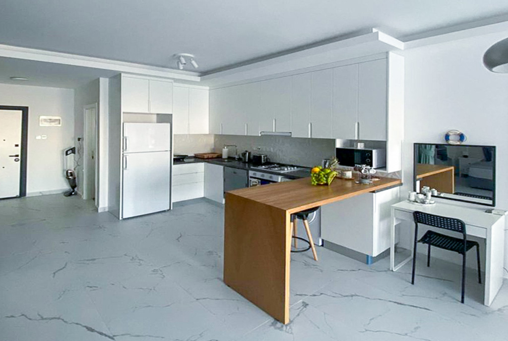 gustowna aranżacja kuchni w luksusowym apartamencie na sprzedaż Cypr Iskele Mackenzie Ave