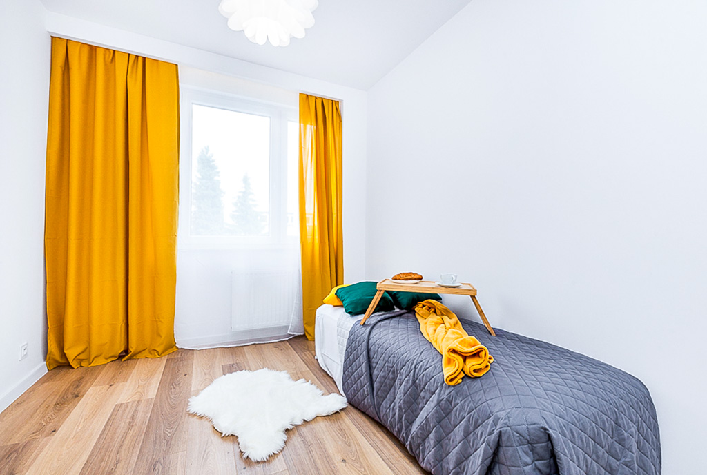 na zdjęciu komfortowa sypialnia w ekskluzywnym apartamencie na sprzedaż Gdańsk